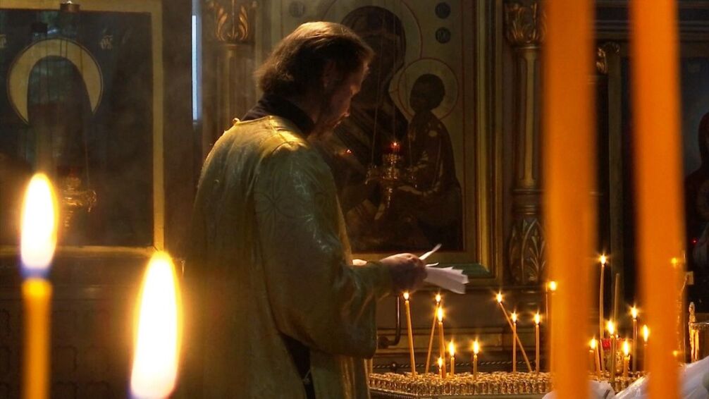 priest in church and smoking in fasting